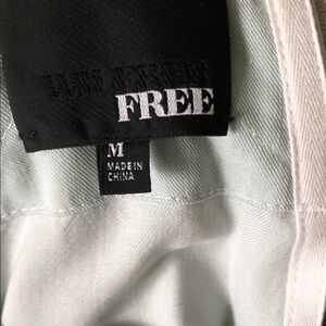 Mint Green Suspender shorts.  Zipped side pockets.  Drawstring waist.